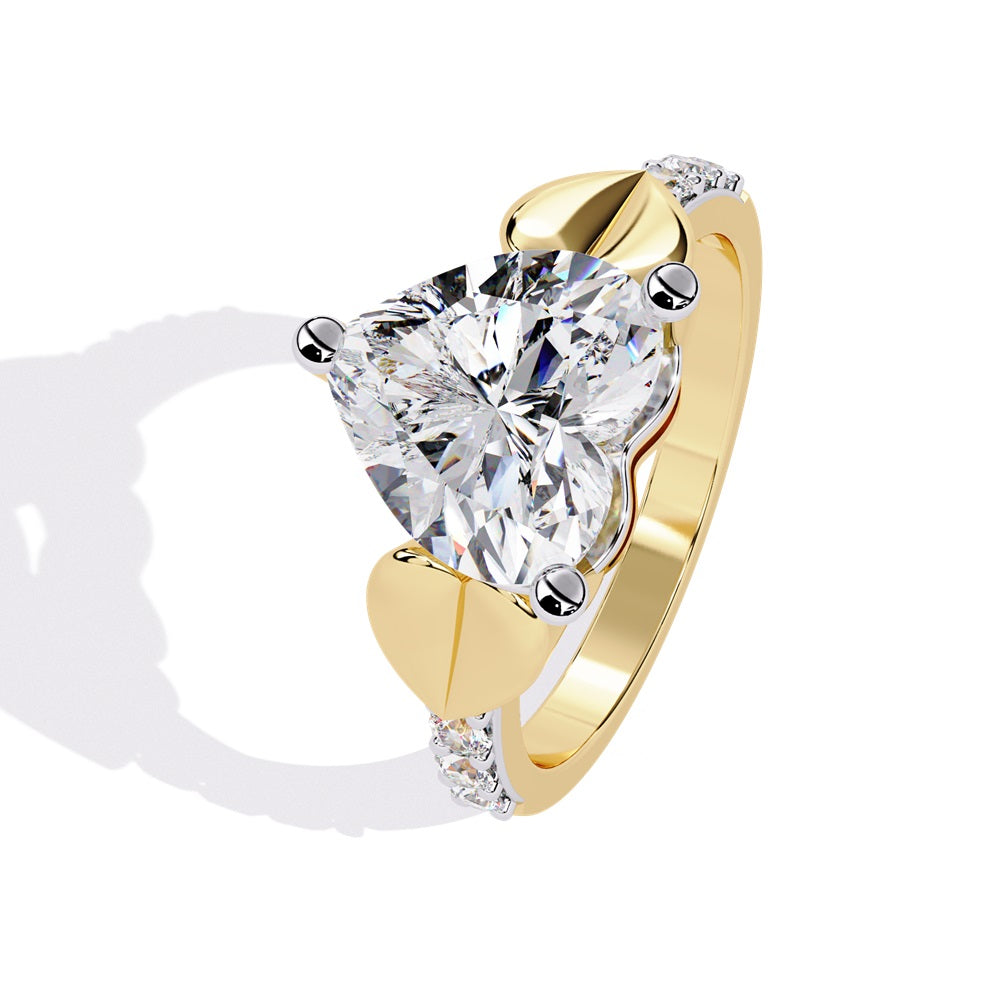 A stunning heart-shaped diamond engagement ring in gold featuring two gold hearts on either sides, perfect for a romantic proposal.