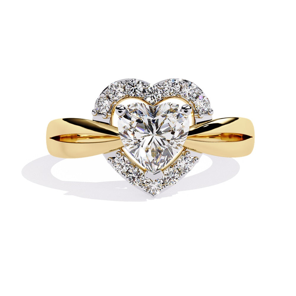 A heart-shaped diamond ring in gold, featuring a solitaire design with a halo of smaller diamonds surrounding it.