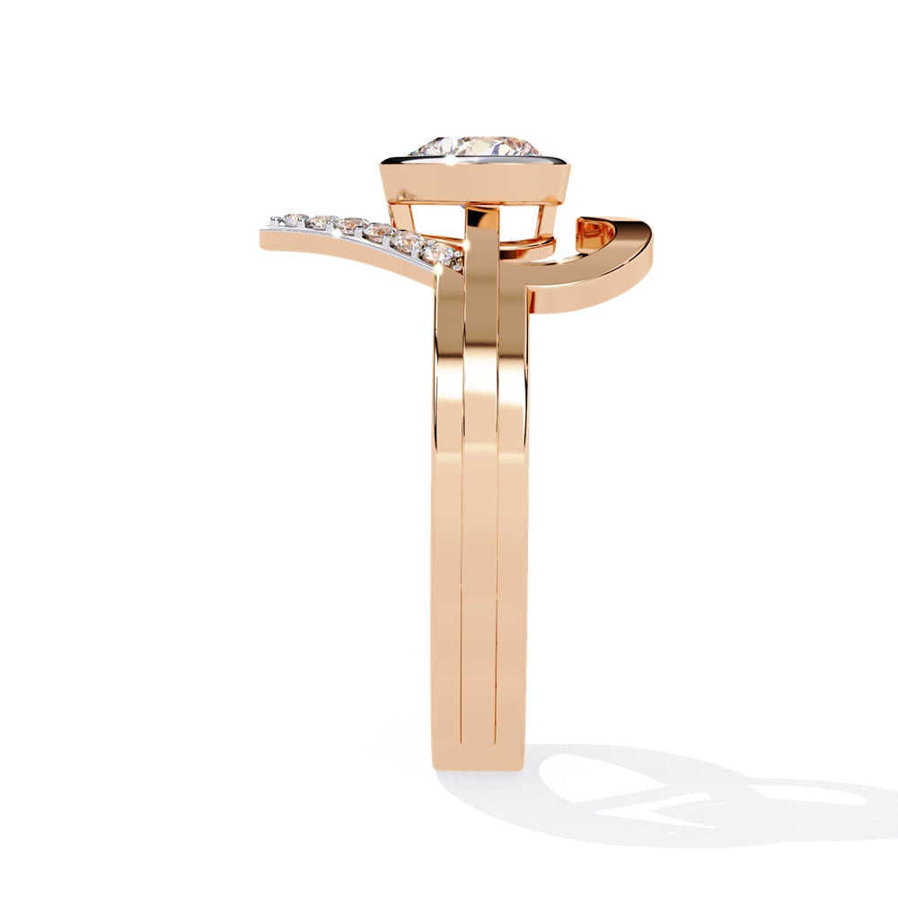 A heart-shaped diamond ring in gold, featuring a solitaire design with a gold halo surrounding it.