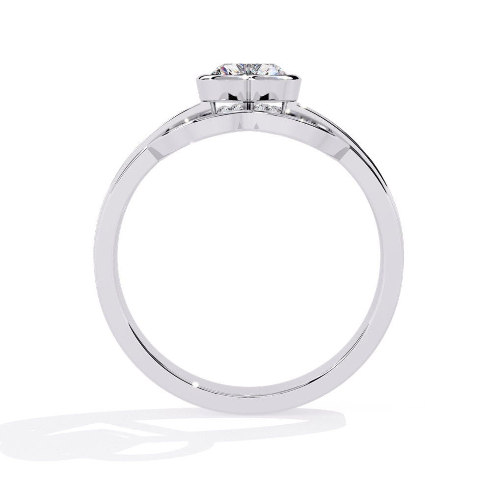 A heart-shaped diamond ring in gold, featuring a solitaire design with a gold halo surrounding it.