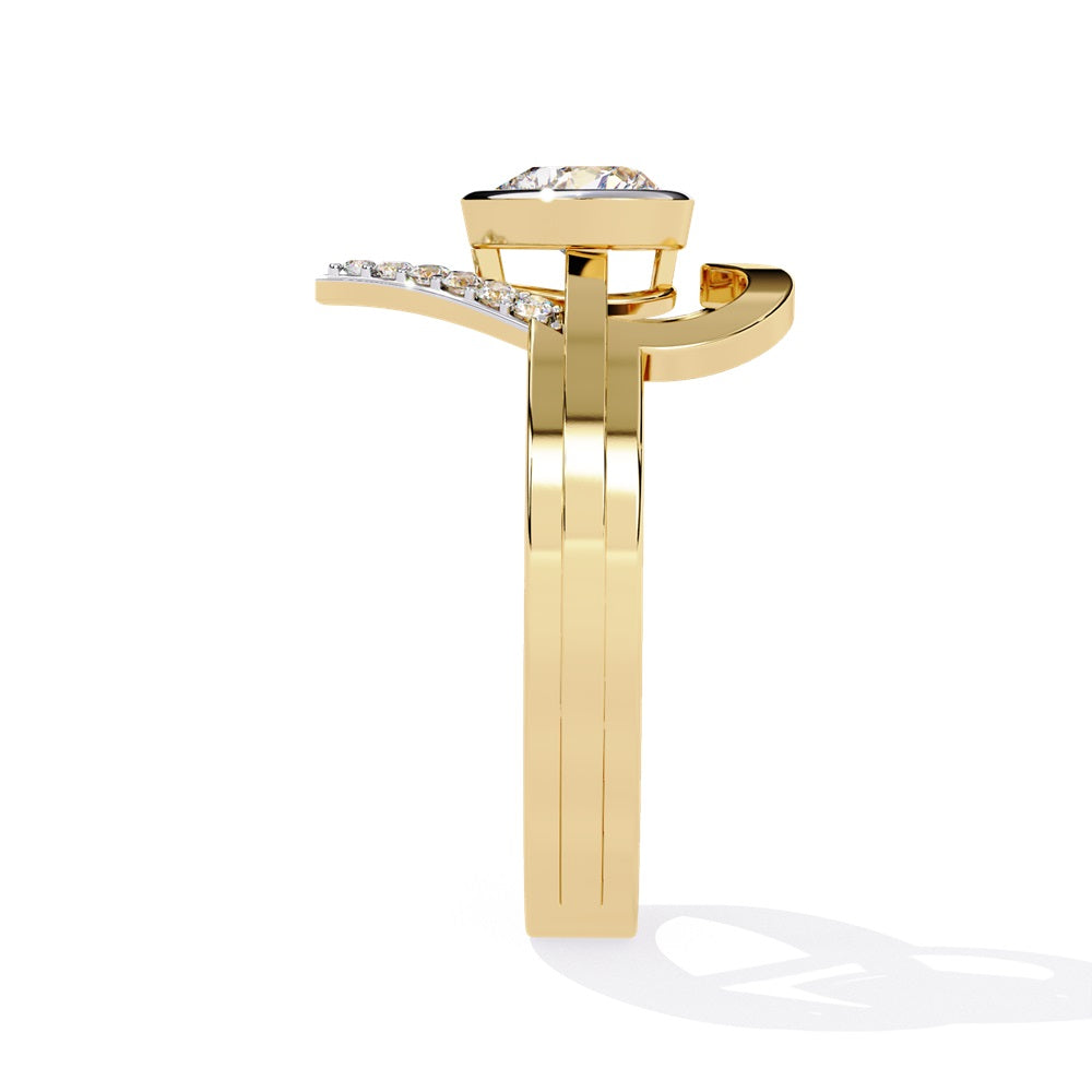 A heart-shaped diamond ring in gold, featuring a solitaire design with a gold halo surrounding it.