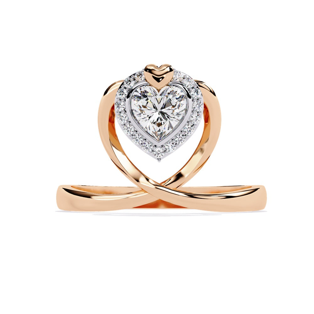 A heart-shaped diamond ring in gold, featuring a solitaire design with a halo of smaller diamonds surrounding it.