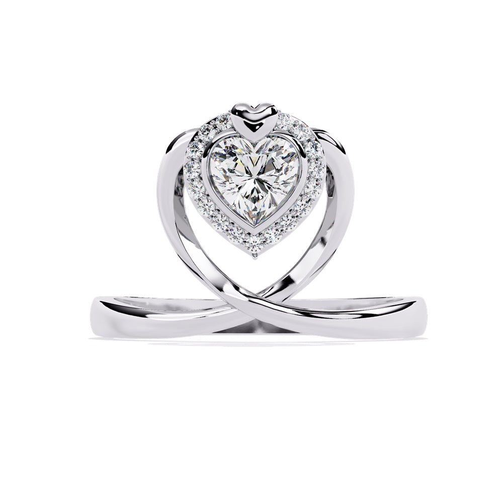 A heart-shaped diamond ring in gold, featuring a solitaire design with a halo of smaller diamonds surrounding it.