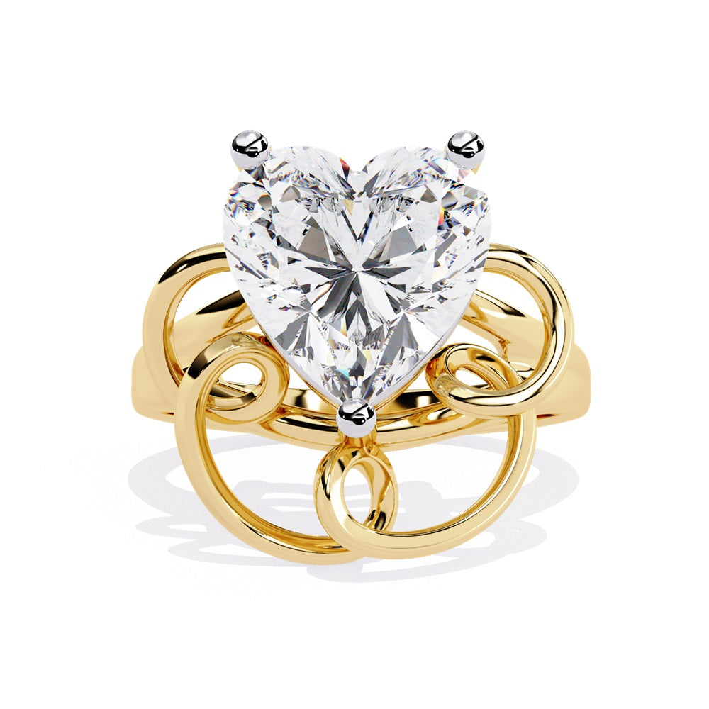 A heart-shaped diamond ring in gold, featuring a solitaire design featuring an intricate pattern below the heart.