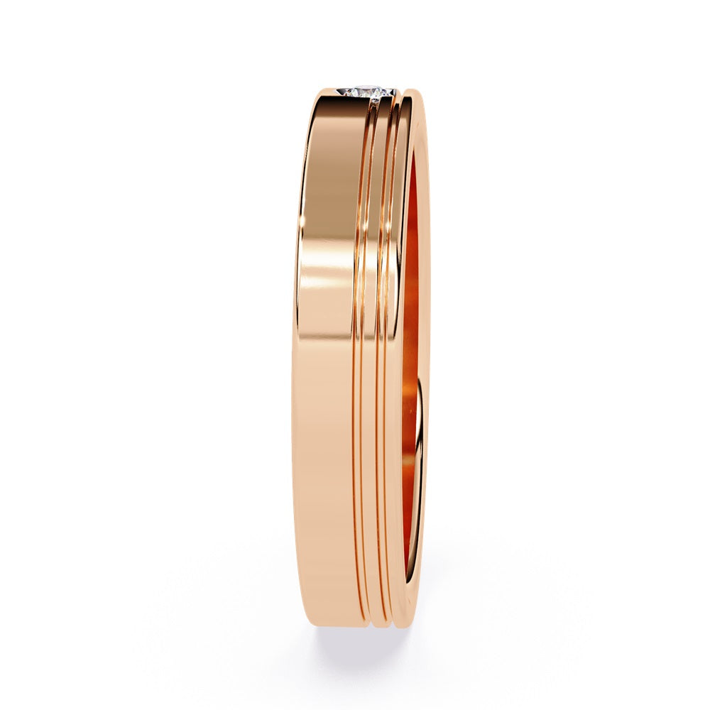 Two elegant gold wedding bands adorned with diamonds, symbolizing love and commitment for a couple.
