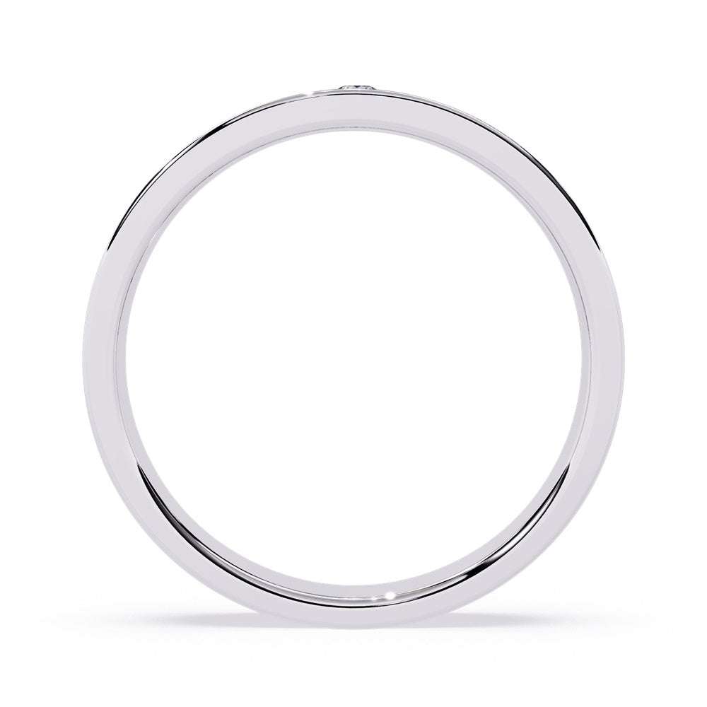 Two elegant gold wedding bands adorned with diamonds, symbolizing love and commitment for a couple.