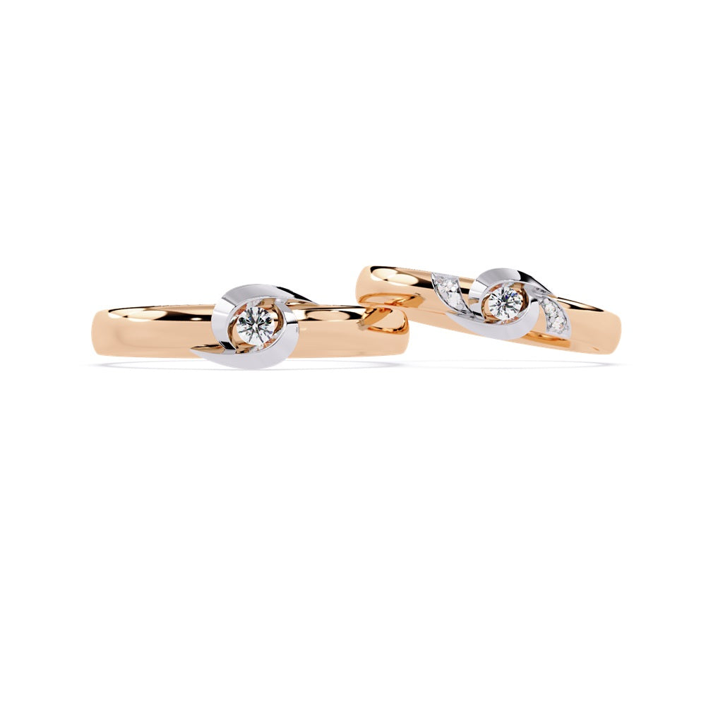 Two stunning rose gold wedding bands, each set with diamonds, embodying the love shared by a couple.