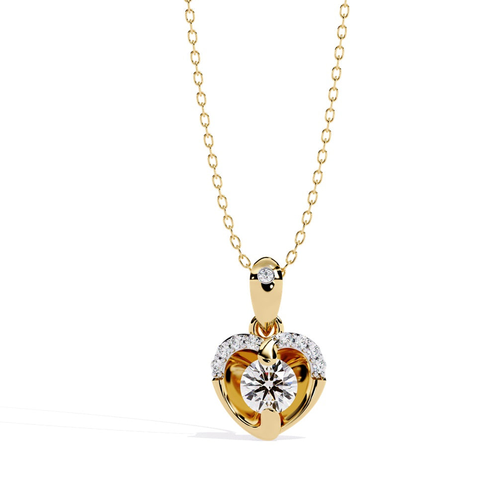 A gold and diamond heart pendant, elegantly designed to showcase its sparkling beauty and romantic appeal.