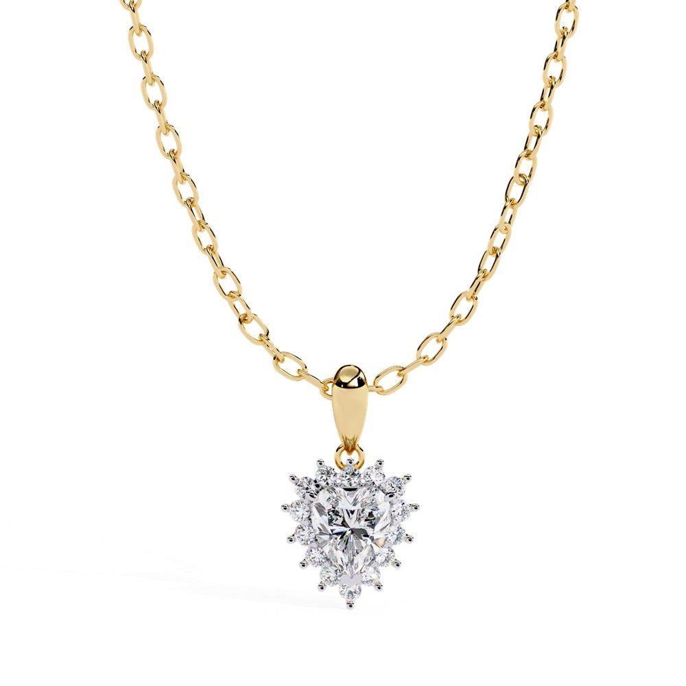 The Niraa Radiant Heart Shape Diamond Solitaire Pendant features a beautifully detailed gold chain and heart-shaped diamond encircled by smaller gems on a pristine white background, creating a sparkling and elegant design.