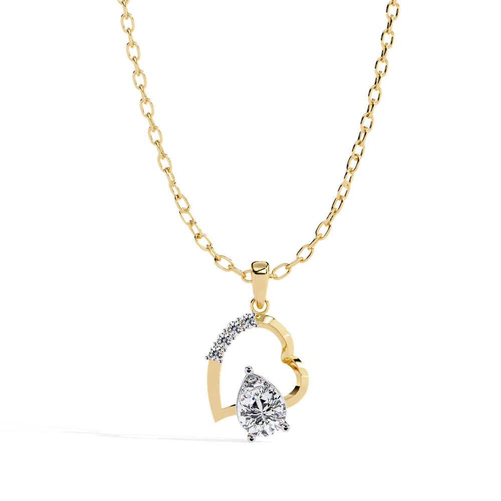 The Loves Sparkle Pear Shape Diamond Solitaire Pendant by Niraa is a gold necklace showcasing a heart-shaped pendant with small diamonds and a central teardrop-shaped diamond, exuding elegance and sophistication.