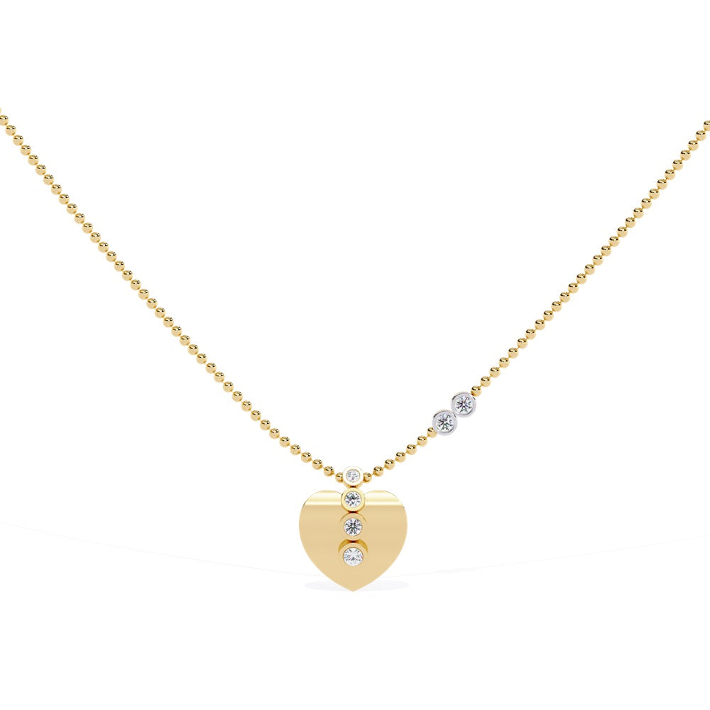 The Niraa Twinkle Heart Diamond Pendant is a gold necklace with a bead chain and heart-shaped pendant, showcasing three diamond-like stones. Its elegant design is completed with two additional stones on one side, set against a white background.