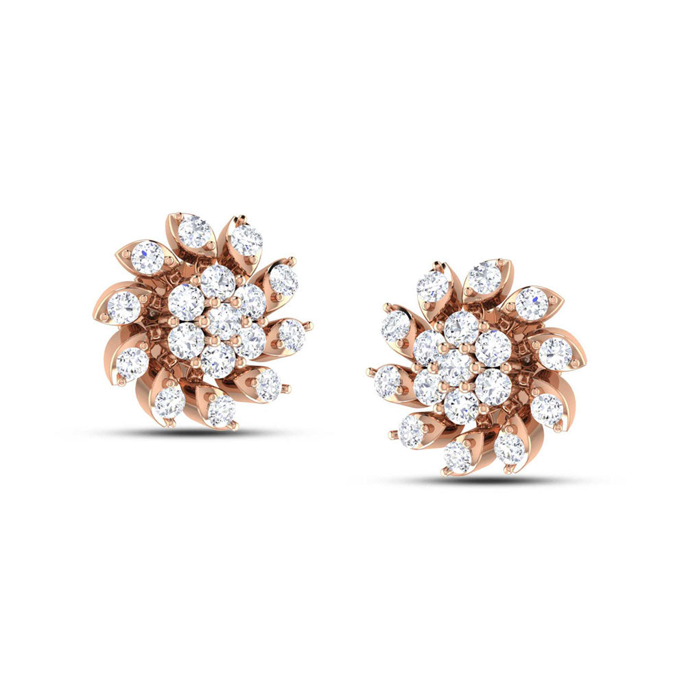 The Cassandra Diamond Earrings by Niraa are elegant floral designs in gold, featuring central clusters of round diamonds encircled by petal-shaped diamond arrangements, offering a sparkling, timeless elegance to enhance any outfit.