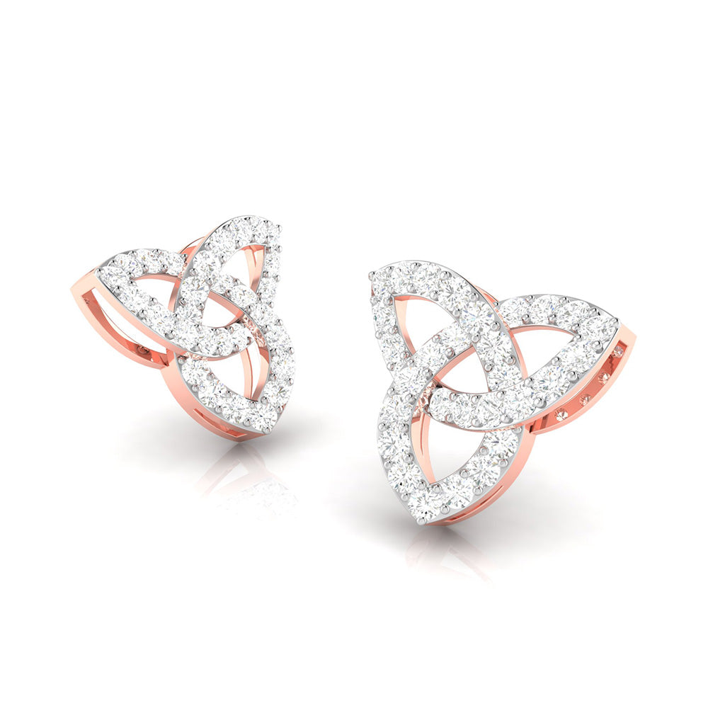 The Clementine Diamond Earrings by Niraa boast intricate trinity knots with polished gold and sparkling diamond accents, reflecting light beautifully. This symmetrical and elegant design is sure to captivate admirers.