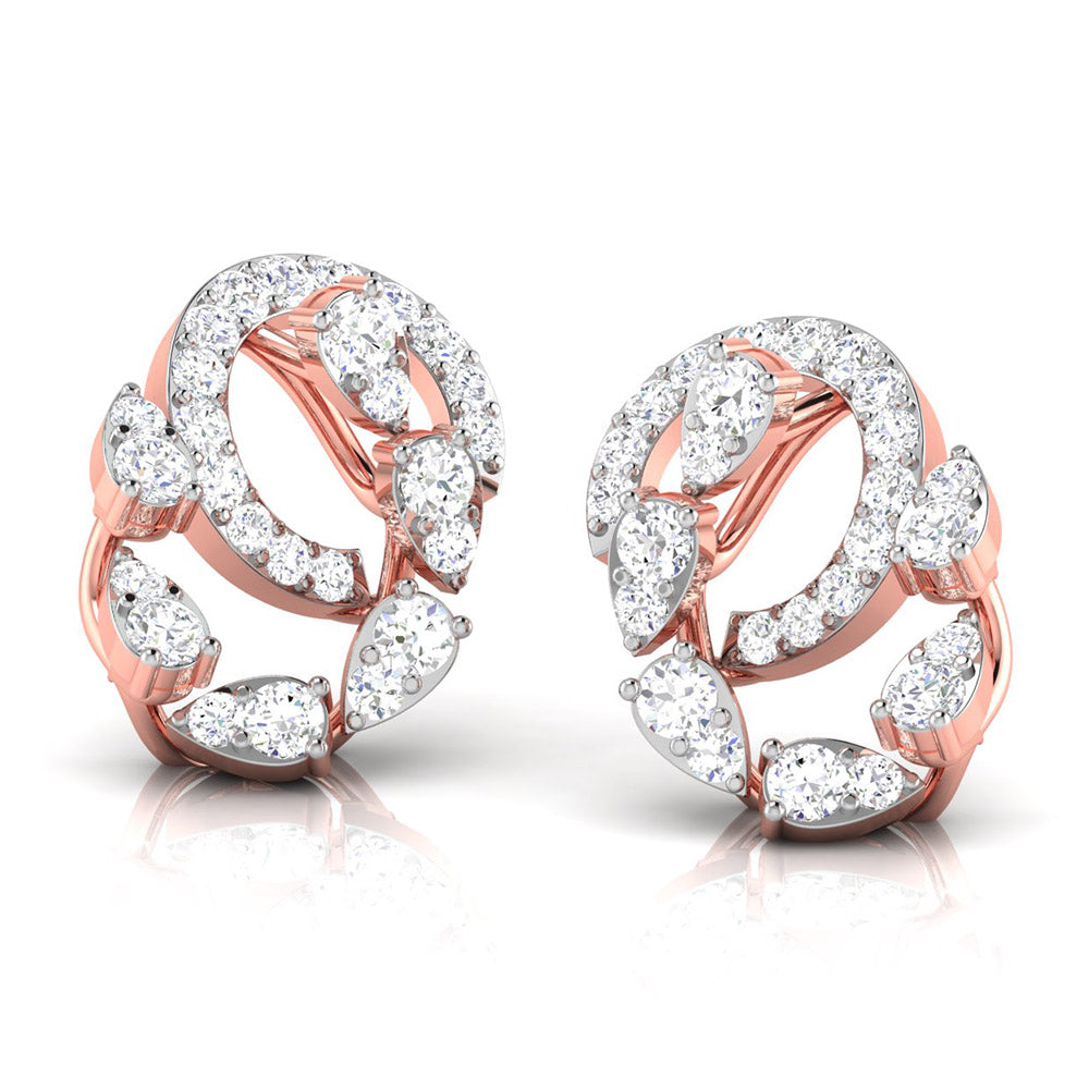 The Daniella Diamond Earrings by Niraa feature intricate loops with pear-shaped and round white gemstones. Their intertwining patterns exude luxury and elegance against a pristine white background.