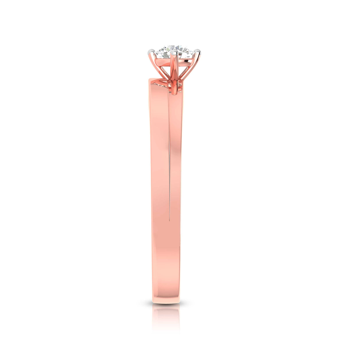The Hailey Diamond Solitaire Ring by Niraa is a luxury rose gold engagement ring with a round, brilliant-cut diamond in a classic prong setting. Its polished band enhances the diamonds allure as it elegantly rests on a reflective surface.