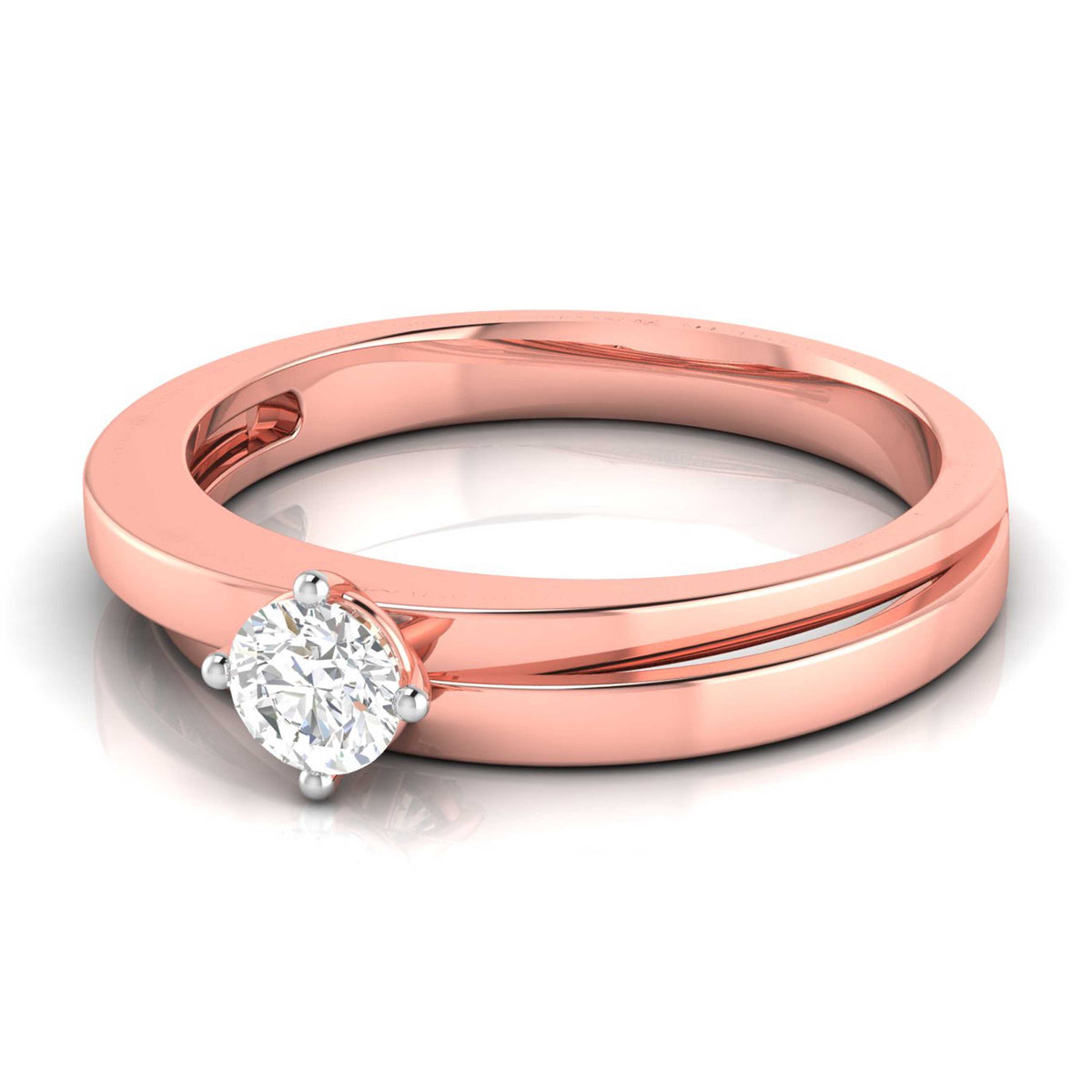 The Hailey Diamond Solitaire Ring by Niraa is a luxury rose gold engagement ring with a round, brilliant-cut diamond in a classic prong setting. Its polished band enhances the diamonds allure as it elegantly rests on a reflective surface.