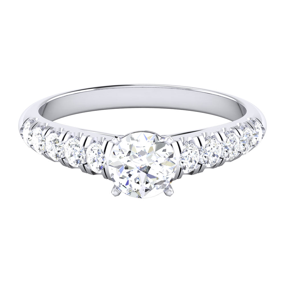 The Niraa Cosmia Diamond Solitaire Ring showcases a large round diamond centerpiece, elegantly flanked by smaller diamonds in a symmetrical pattern along the silver band, creating a timeless design.
