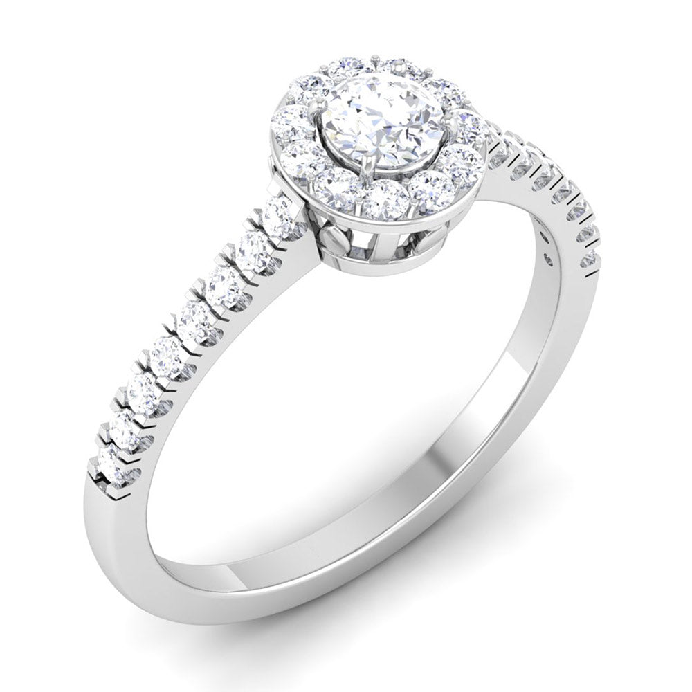 The Roxanne Diamond Solitaire Ring by Niraa features a central round diamond encircled by a halo of smaller diamonds on a silver band, adorned with additional diamonds for an elegant and sophisticated sparkle.