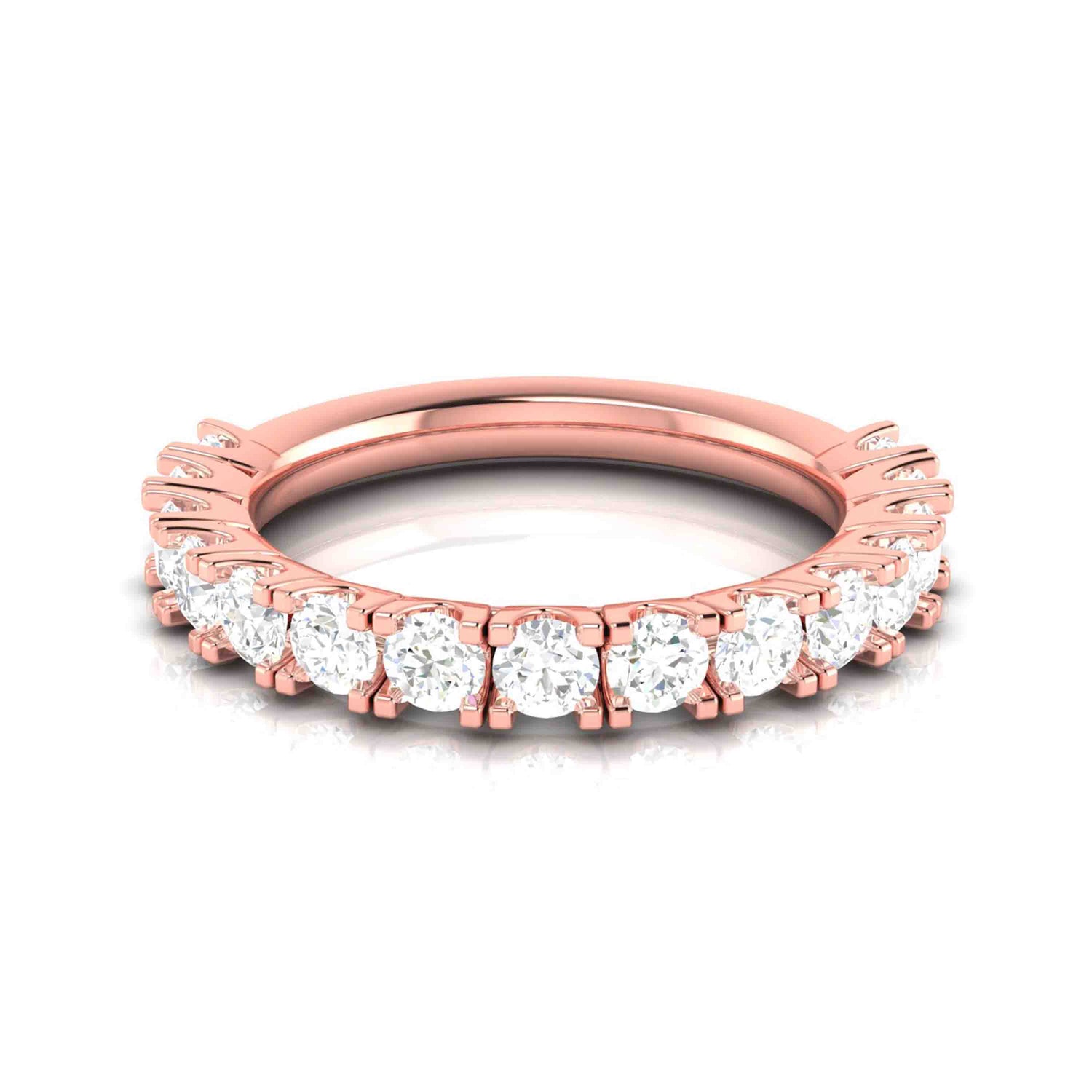 The Daphne Diamond Ladies Ring by Niraa is a rose gold piece adorned with a full circle of small, round diamonds in a prong setting, creating a sparkling effect. Set against a white background, it highlights the intricate details and luxurious appearance of the ring.