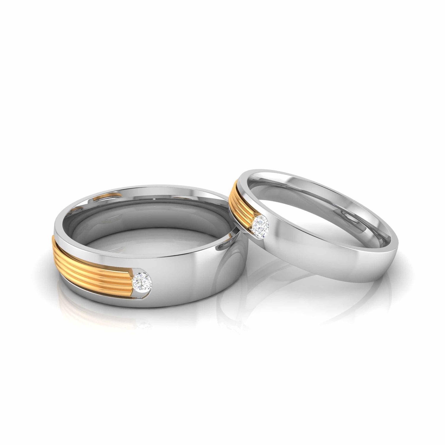 Displayed against a white background, two Irene Diamond Ladies Rings by Niraa feature sleek gold accents and small diamonds. The polished finish subtly reflects light, with one ring leaning against the other to highlight their modern design.