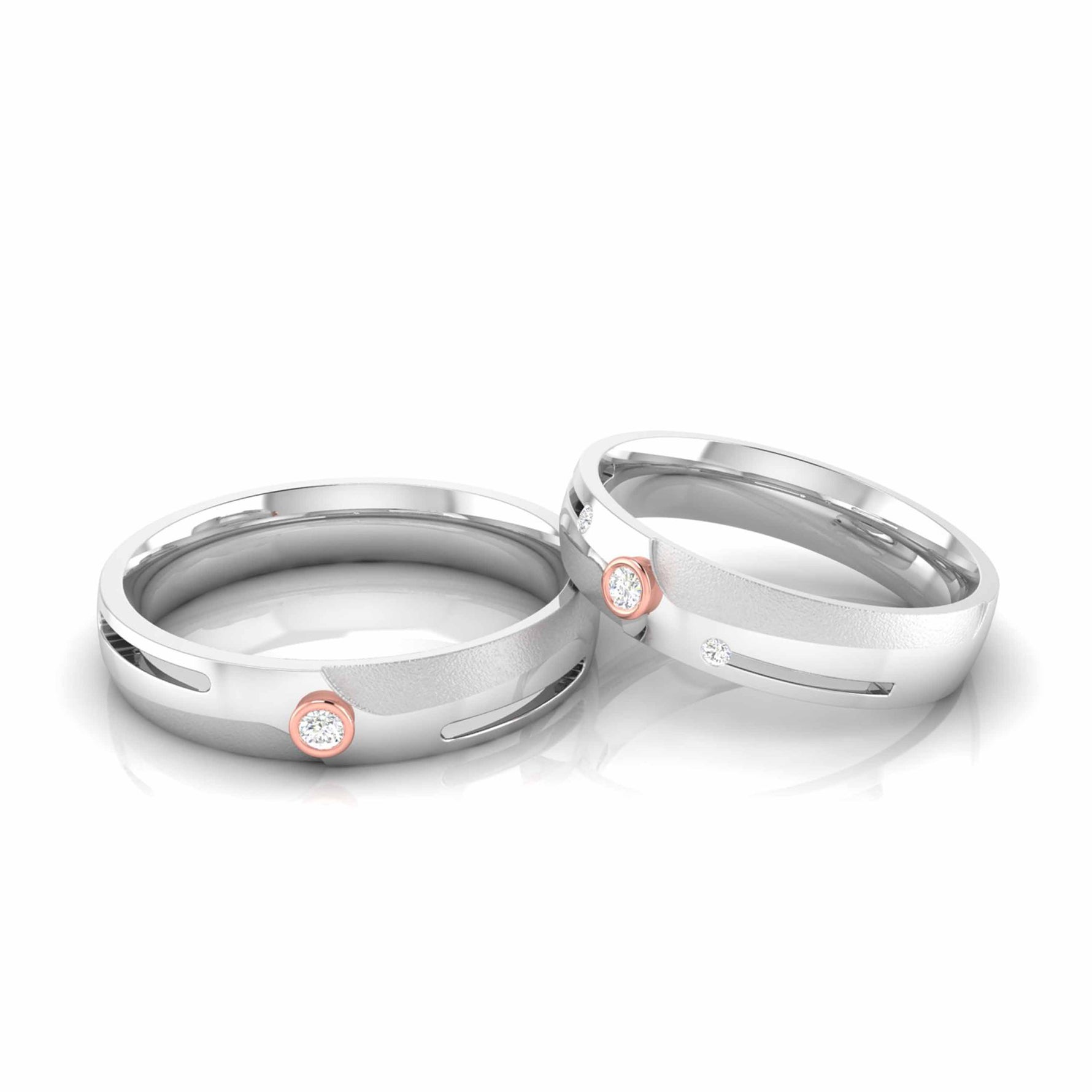 The exquisite Leah Diamond Ladies Rings by Niraa feature luxurious silver bands with a single small diamond set in rose gold accents, elegantly displayed side by side against a pristine white background.