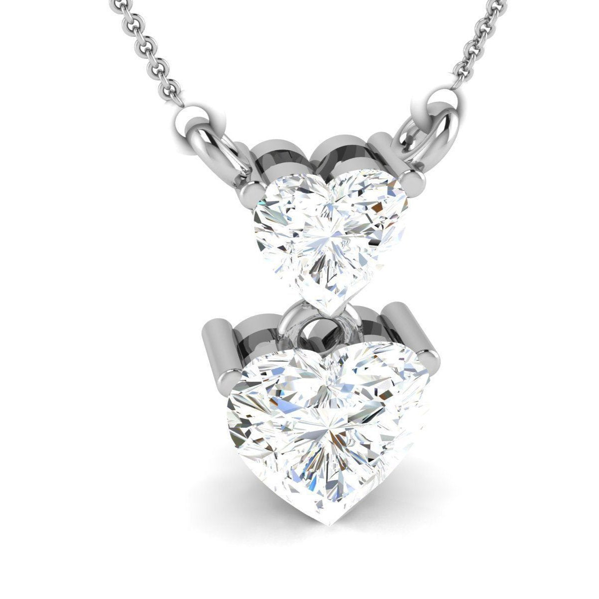 The Elaine Diamond Pendant by Niraa features two heart-shaped diamonds on a silver chain, with a smaller diamond gracefully connecting to a larger one. Intricately cut for brilliance, this romantic piece exudes timeless elegance and sophistication.
