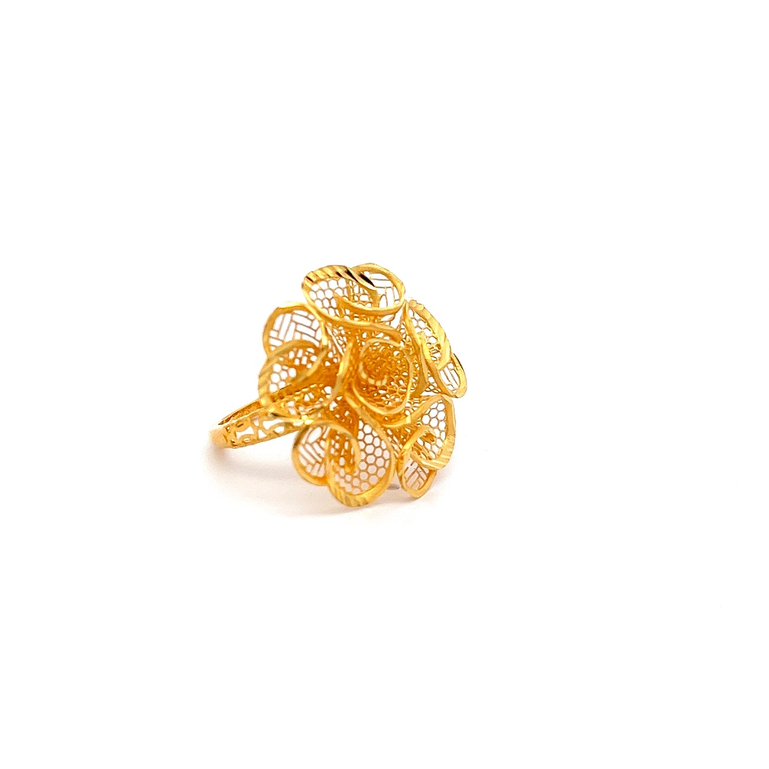 The Avery Gold Ring by Niraa features an exquisite filigree flower design with detailed swirling patterns, beautifully crafted and set against a plain white background to highlight its elegance.