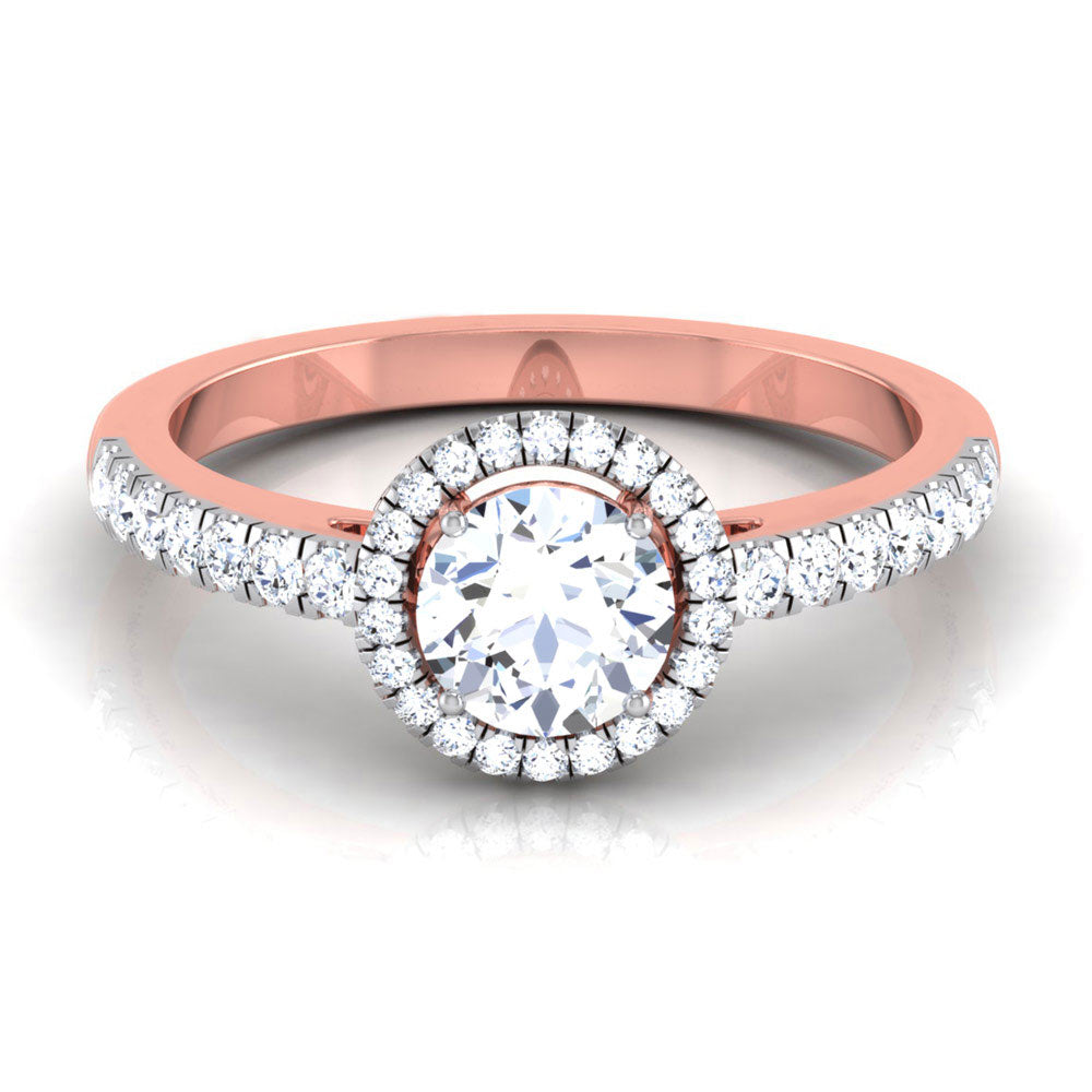 The Gloria Diamond Solitaire Ring by Niraa is a stunning gold engagement ring with a large round diamond surrounded by a shimmering halo of smaller diamonds. The elegantly designed band features additional diamonds on its upper half, forming an exquisite symbol of love and commitment.