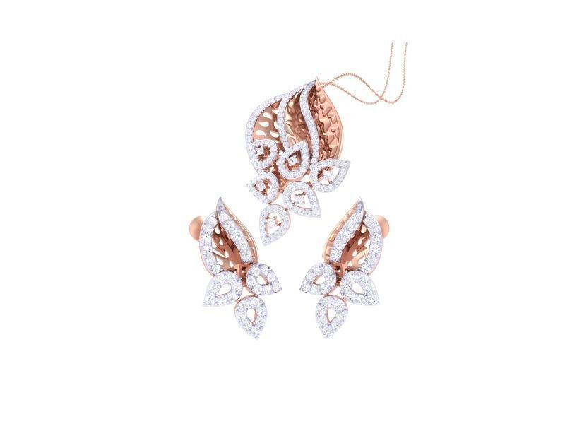 The Silvia Diamond Pendant Set by Niraa features a stunning rose gold jewelry set with intricate leaf designs and sparkling white gems. It includes a necklace and matching earrings, all displayed on a clean white background.
