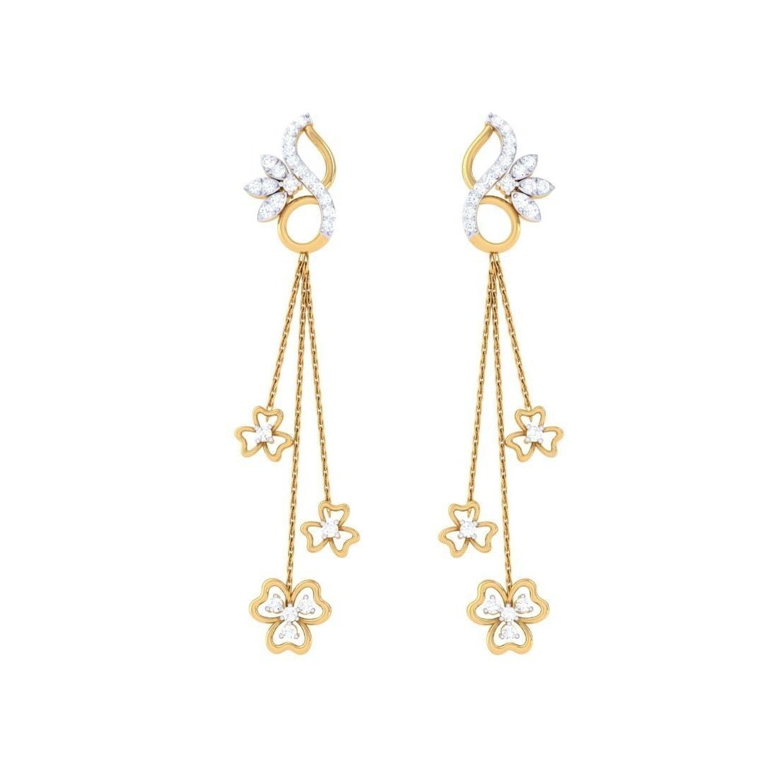 The Kaylee Diamond Earrings by Niraa feature elegant gold with a swirling design, leading to three cascading chains each adorned with flower-shaped charms, epitomizing timeless beauty.