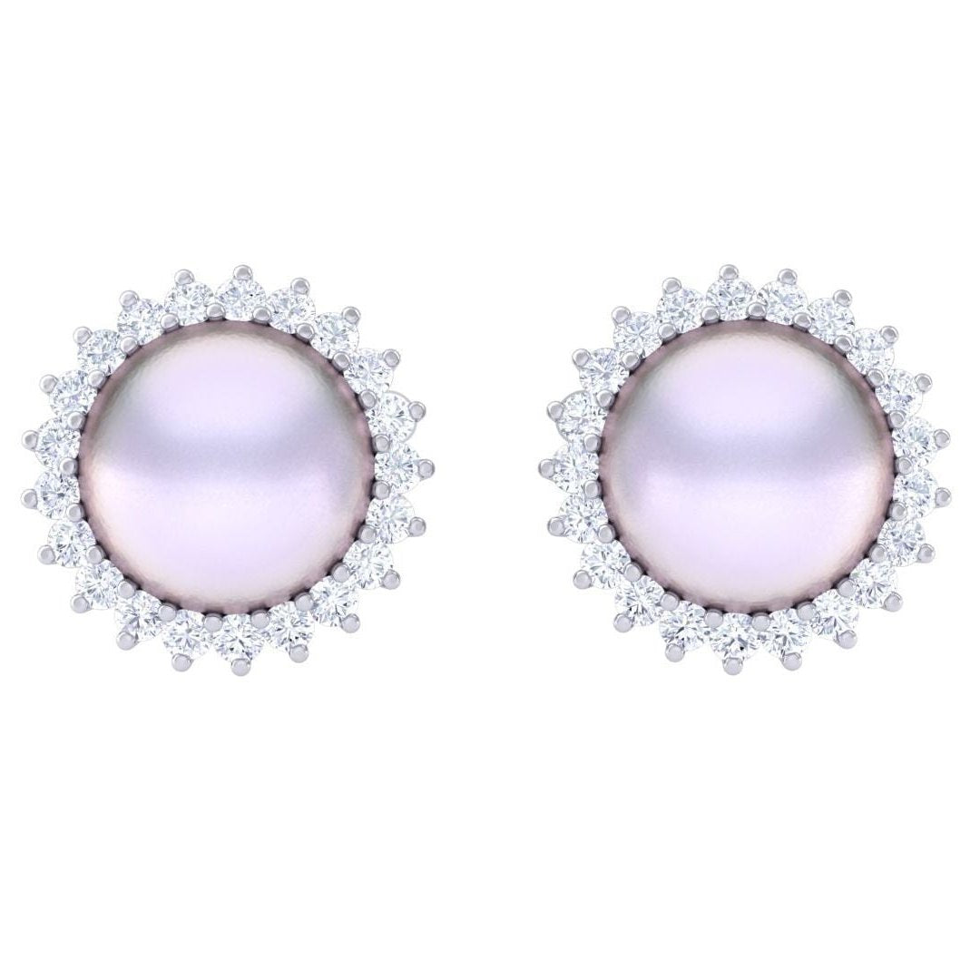 The Leilani Diamond Earrings by Niraa, part of our luxury collection, feature two round pearl studs with a soft pinkish hue, surrounded by a shimmering halo of sparkling diamonds, enhancing their elegance.