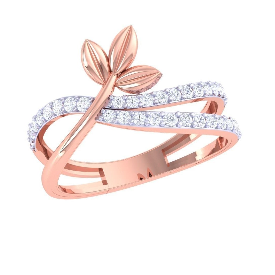 The Niraa Annabelle Diamond Ladies Ring is a luxurious gold accessory featuring an elegant leaf design with intertwined bands of small, sparkling white stones, creating a flowing and refined appearance.