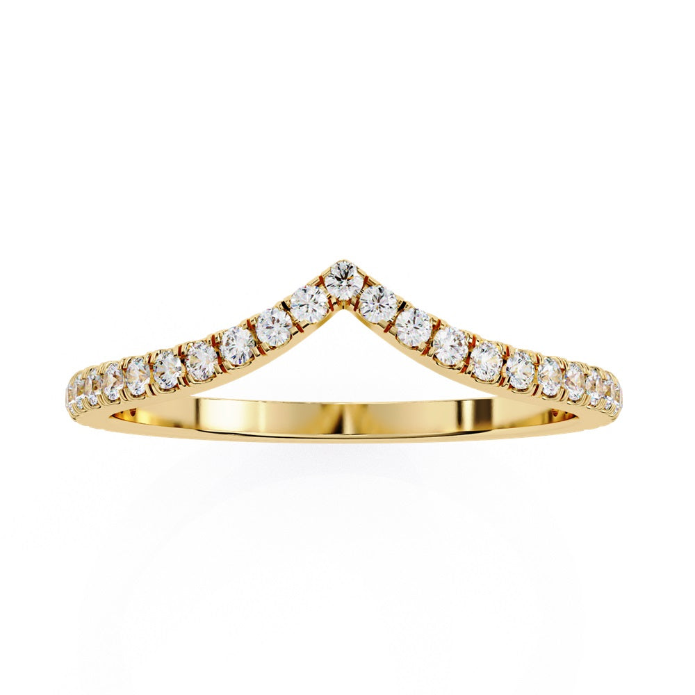 The Stackable Diamond Chevron Band by Niraa is a thin gold ring featuring a chevron design with sparkling diamonds on the top edge, perfect for your stackable ring collection against a white background.