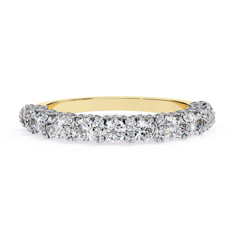 Discover the allure of Niraas Garland Diamond Band, a luxurious gold ring adorned with large, round, sparkling diamonds elegantly covering two-thirds of its surface, beautifully revealing the gleaming gold beneath.