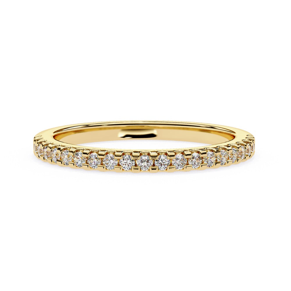 The Niraa Hope Diamond Band is a luxurious gold ring featuring a single row of small, sparkling diamonds. Its polished finish enhances the brilliance, making it truly exquisite.