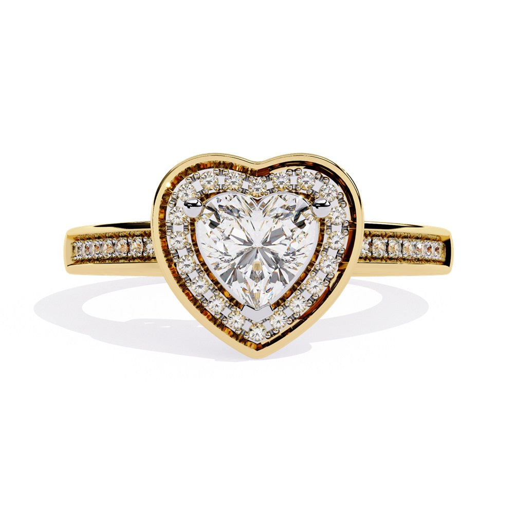 A heart-shaped diamond ring in gold, featuring a solitaire design with a halo of smaller diamonds surrounding it.