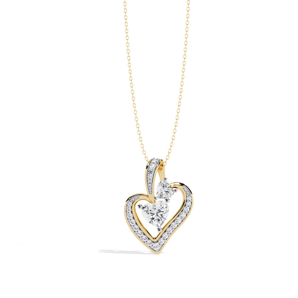A diamond heart pendant necklace in gold featuring a stunning hear shape solitaire diamond centerpiece.