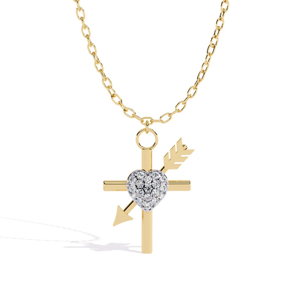 Gold necklace pendant featuring a cross with an arrow piercing through it diagonally. A heart with embedded stones is at the center, attached to a gold chain.