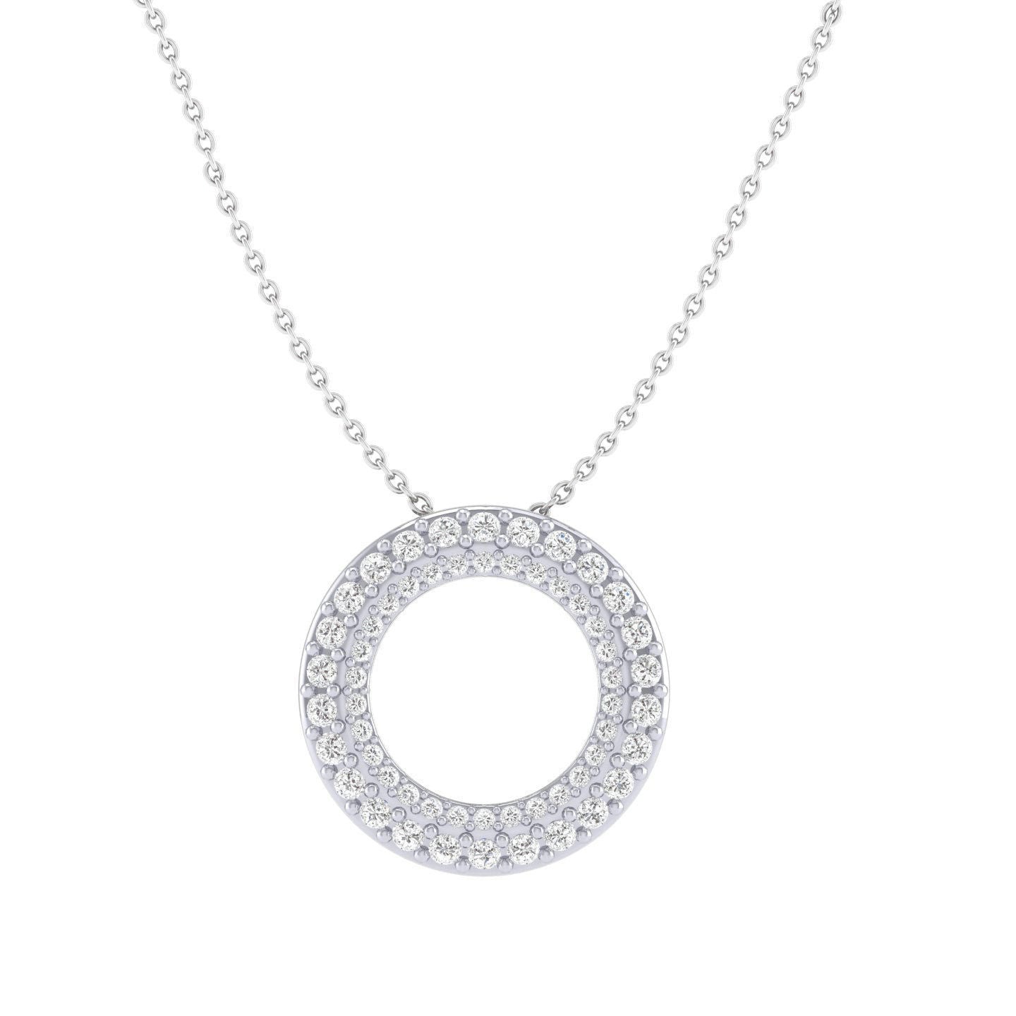 The Braelyn Diamond Pendant by Niraa is a silver necklace with a circular pendant adorned with sparkling crystals in concentric circles, elegantly hanging from a delicate chain.